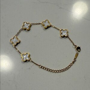 Elegant Gold and White Clover Bracelet